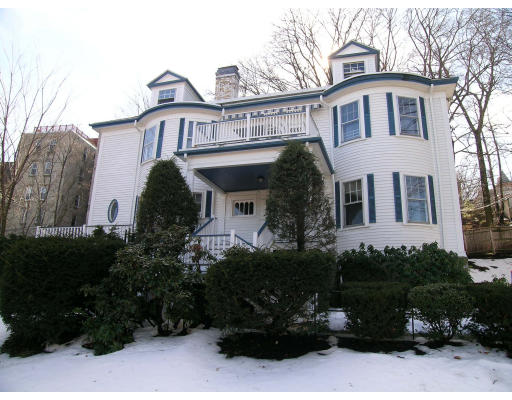 79 University Road, Unit 791 Brookline, MA 02445 - Photo 1 of 1 a front view of a house with a garden