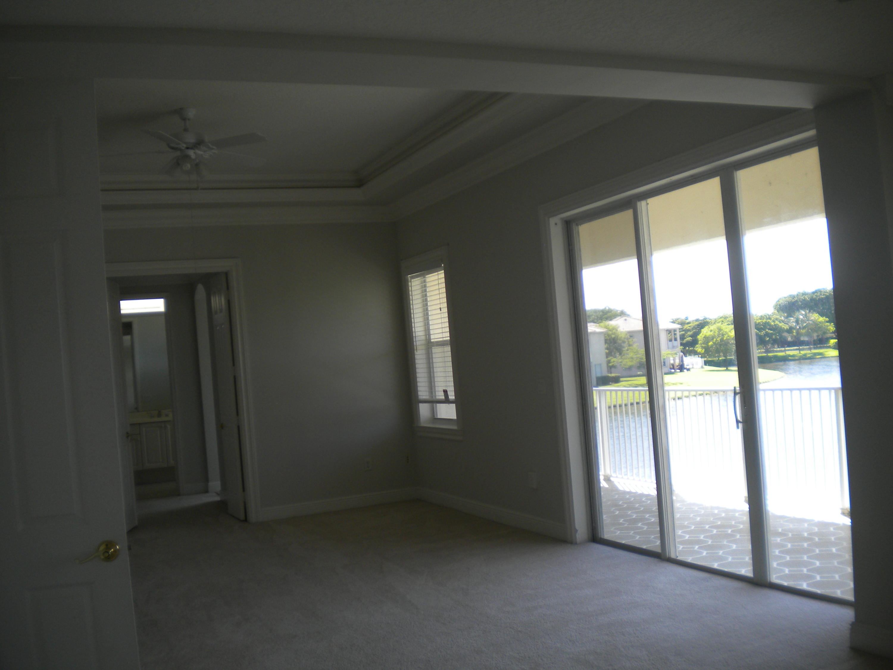 9615 Shepard Place Wellington, FL 33414 - Photo 11 of 46 an empty room with windows