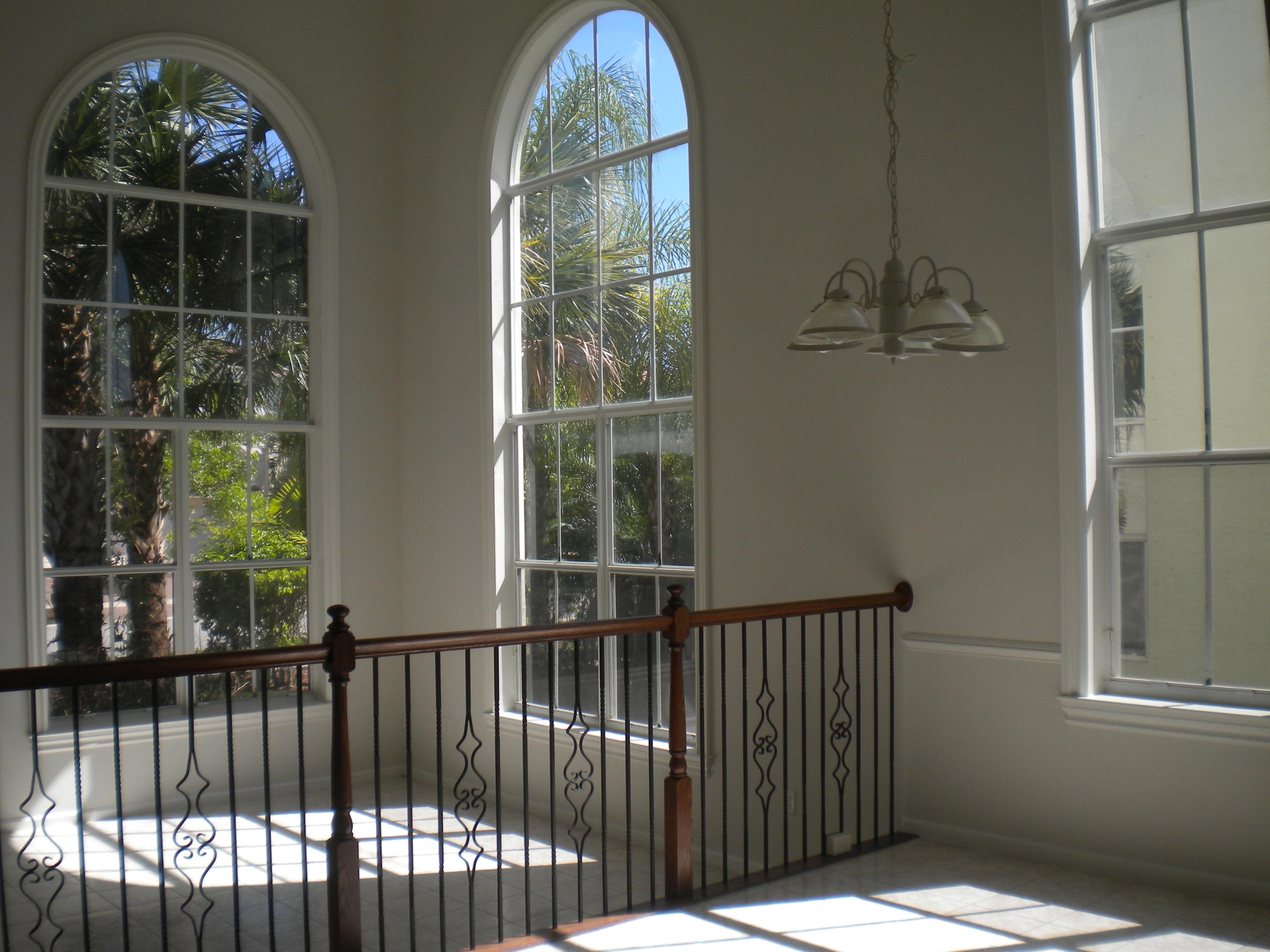 9615 Shepard Place Wellington, FL 33414 - Photo 15 of 46 a view of staircase with open kitchen view