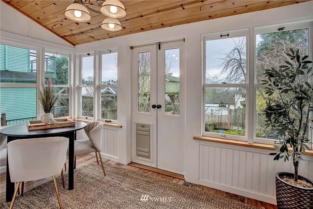 815 20th Avenue South Seattle, WA 98144 - Photo 19 of 33 a view of a livingroom with furniture wooden floor and a chandelier
