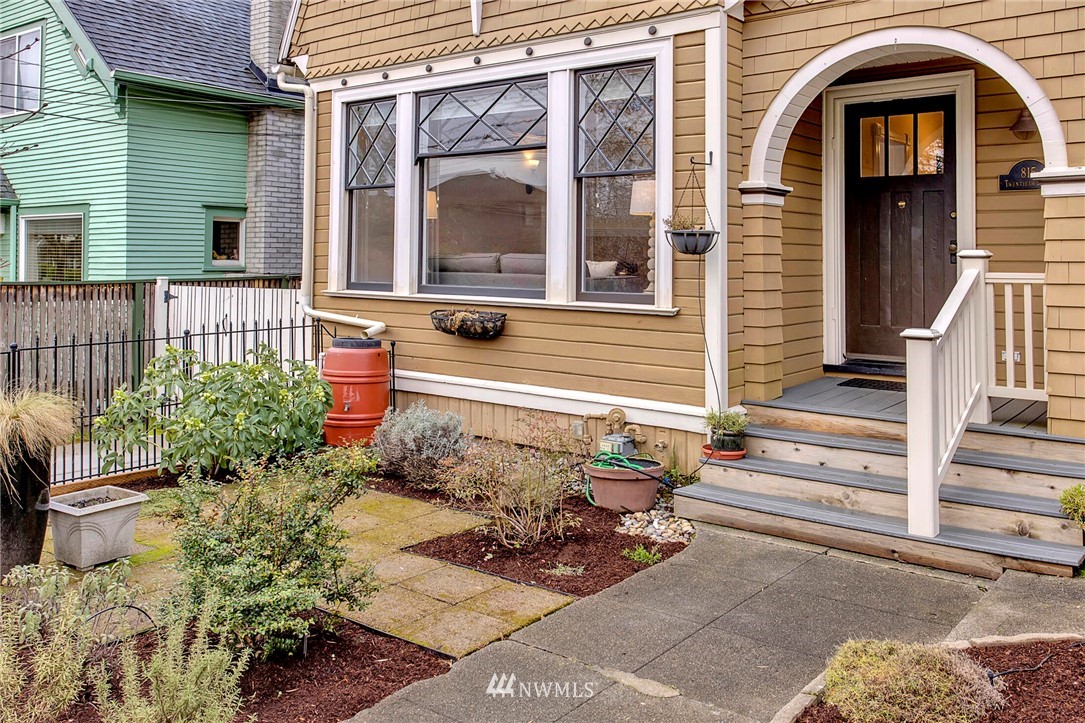 815 20th Avenue South Seattle, WA 98144 - Photo 2 of 33 a front view of a house with a garden