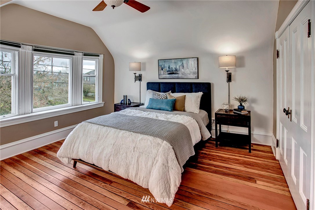 815 20th Avenue South Seattle, WA 98144 - Photo 21 of 33 a bedroom with a bed and a chandelier