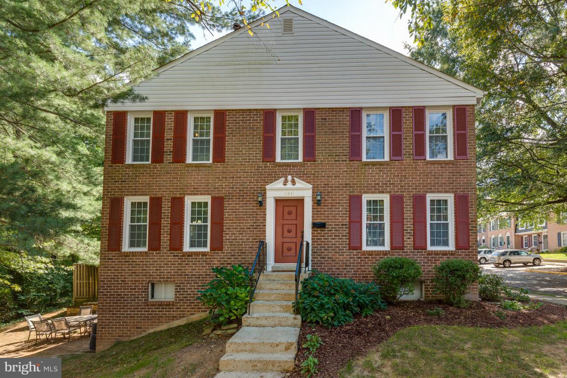 11841 Dunlop Court Reston, VA 20191 - Photo 2 of 30 a front view of a house with garden