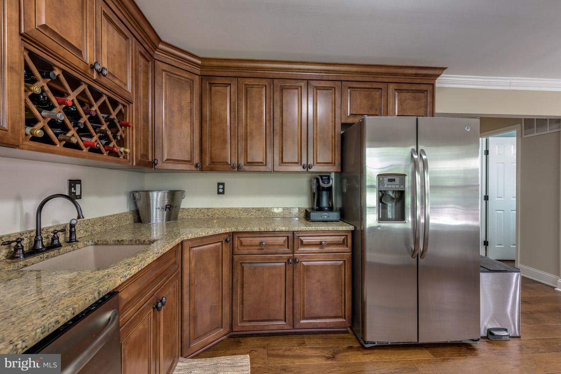 11841 Dunlop Court Reston, VA 20191 - Photo 17 of 30 a kitchen with stainless steel appliances granite countertop a refrigerator and a sink
