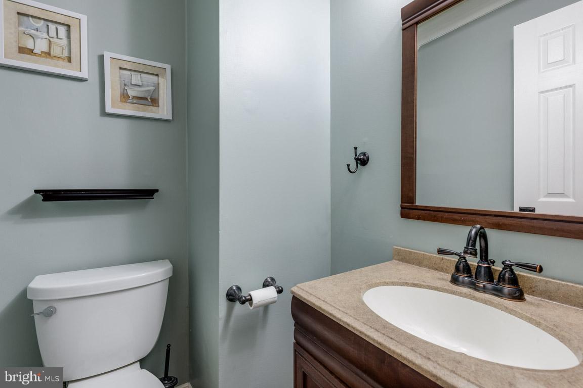 11841 Dunlop Court Reston, VA 20191 - Photo 18 of 30 a bathroom with a toilet sink and mirror