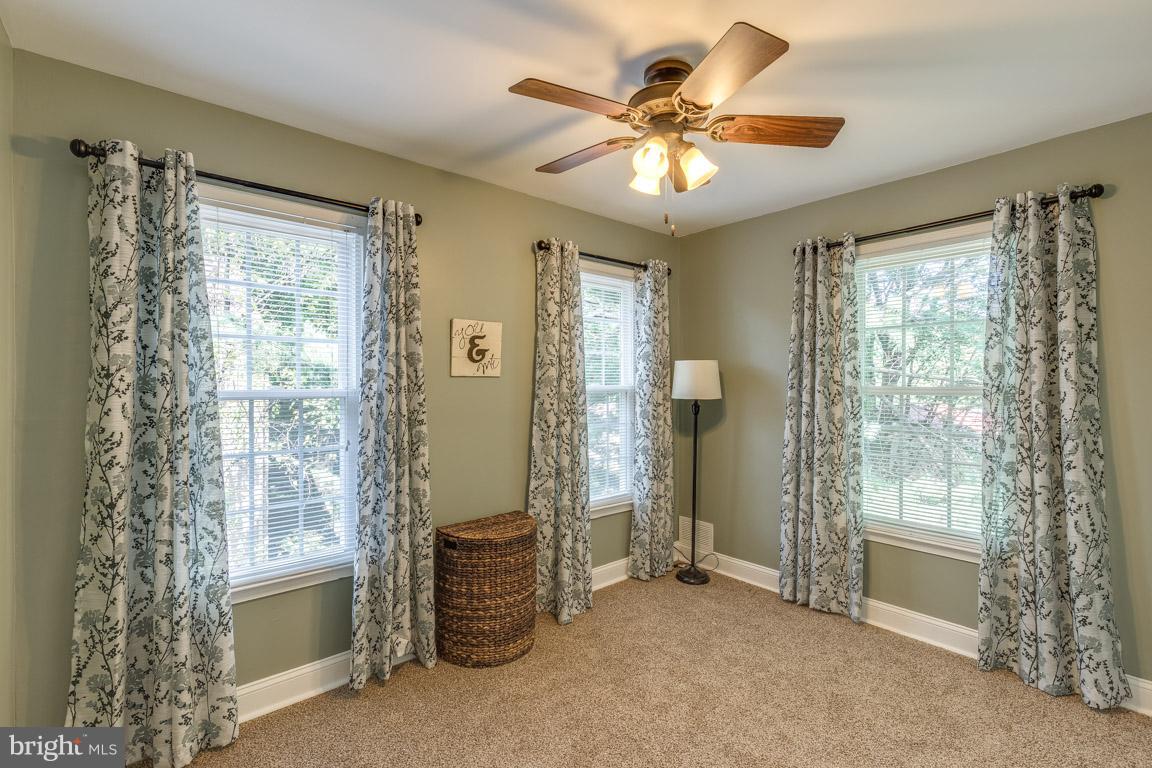 11841 Dunlop Court Reston, VA 20191 - Photo 19 of 30 a view of a livingroom with a ceiling fan and window
