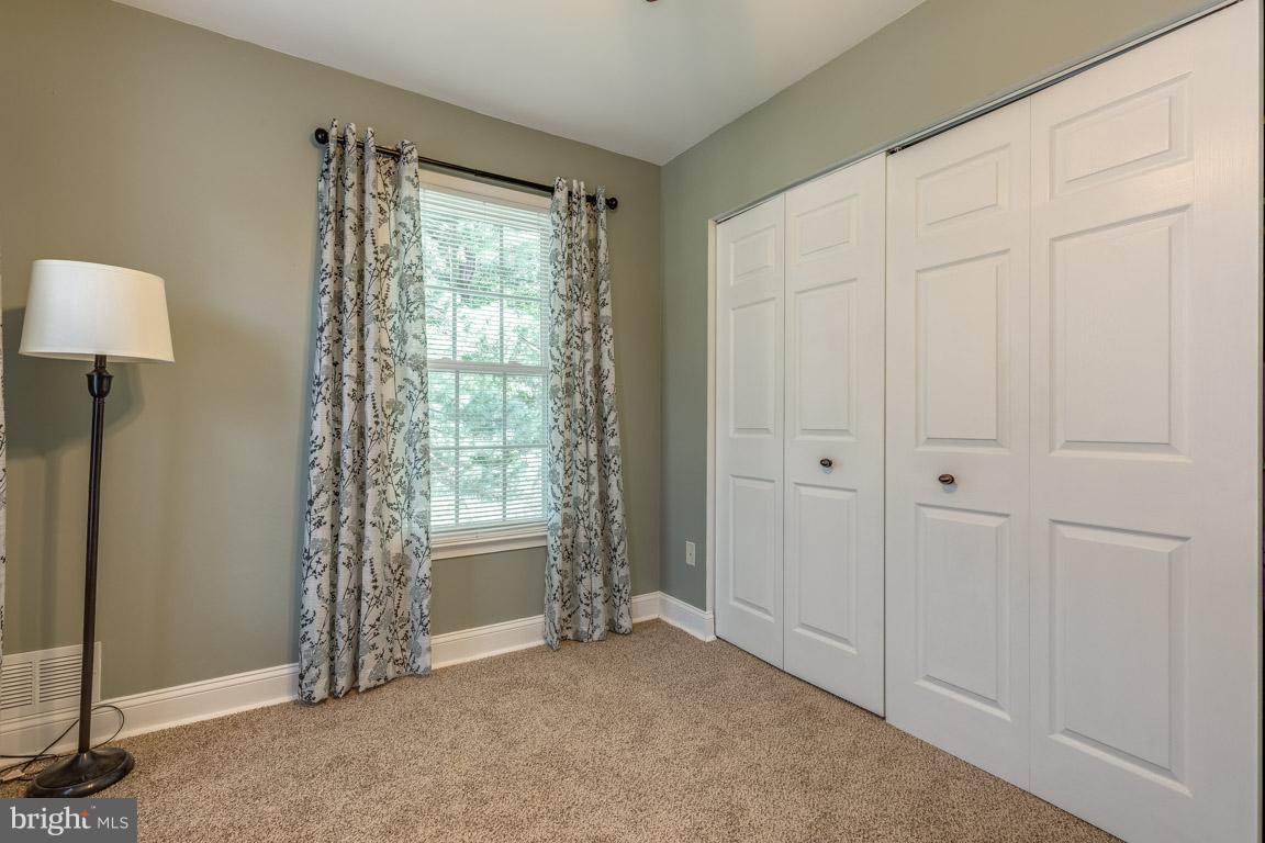 11841 Dunlop Court Reston, VA 20191 - Photo 20 of 30 a view of an empty room with a window