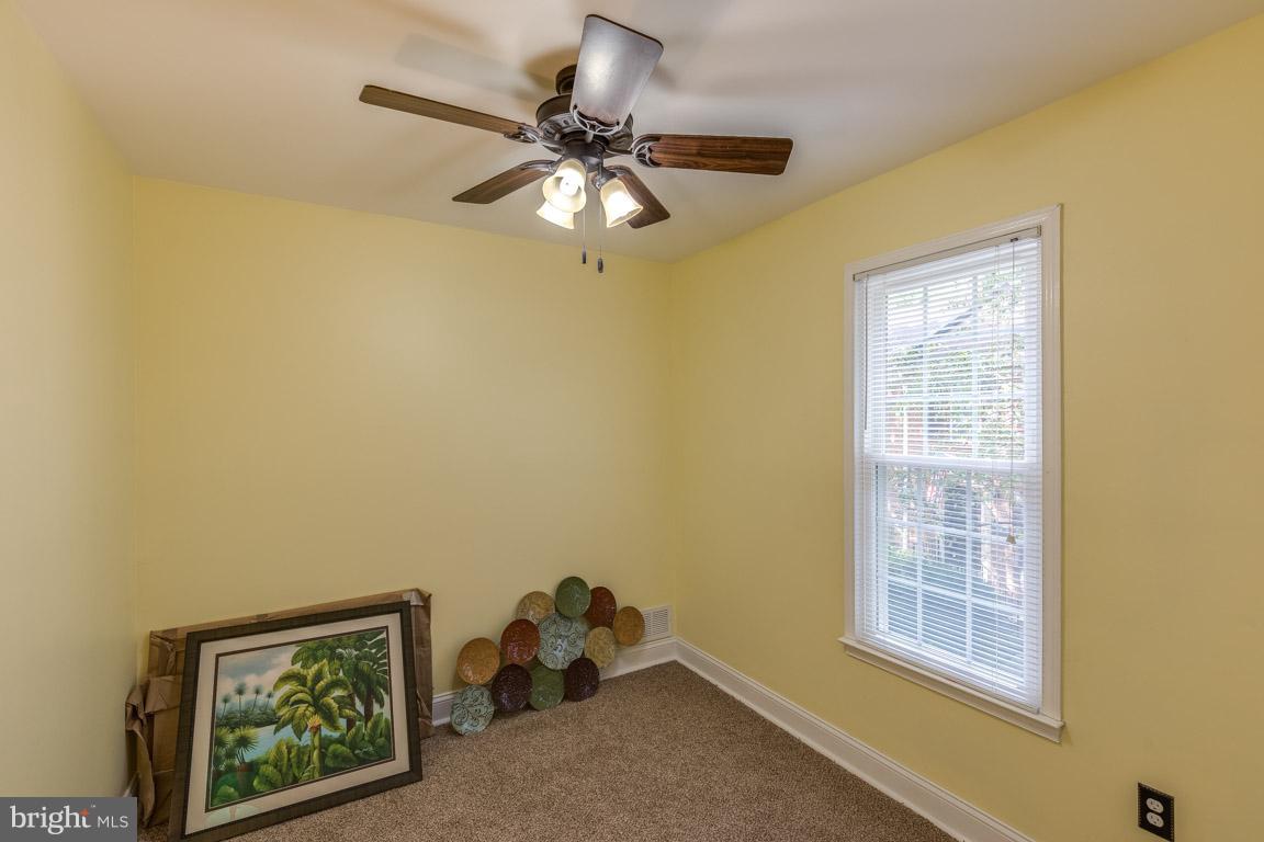 11841 Dunlop Court Reston, VA 20191 - Photo 21 of 30 a view of a workspace with furniture and a window
