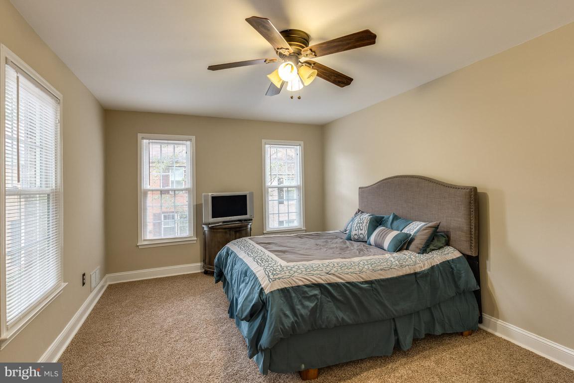 11841 Dunlop Court Reston, VA 20191 - Photo 24 of 30 a bedroom with a bed and window