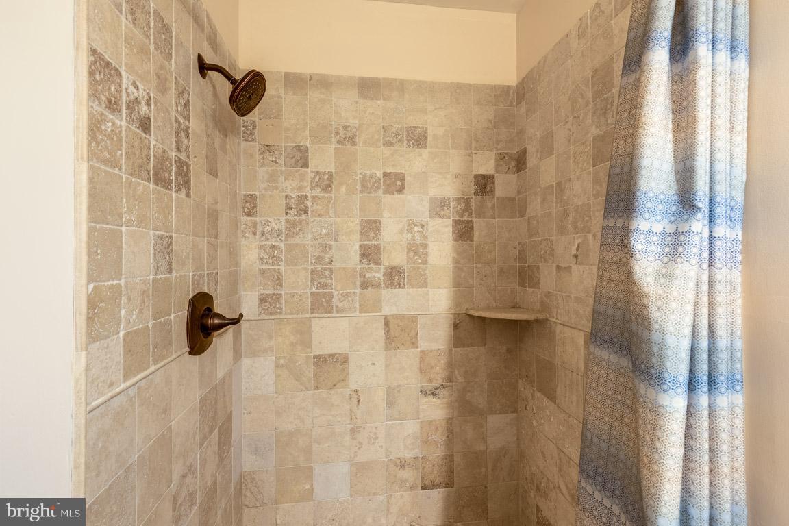 11841 Dunlop Court Reston, VA 20191 - Photo 27 of 30 a bathroom with a shower