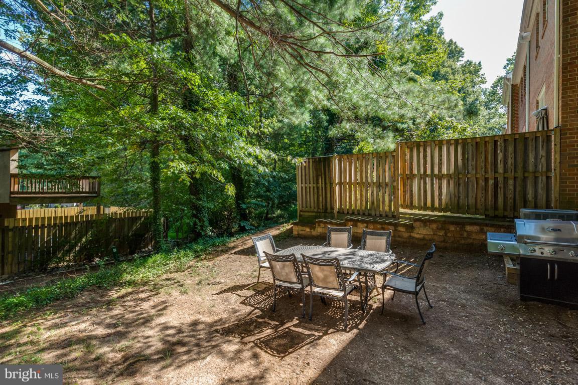 11841 Dunlop Court Reston, VA 20191 - Photo 5 of 30 a view of a chairs and table in the back yard of the house