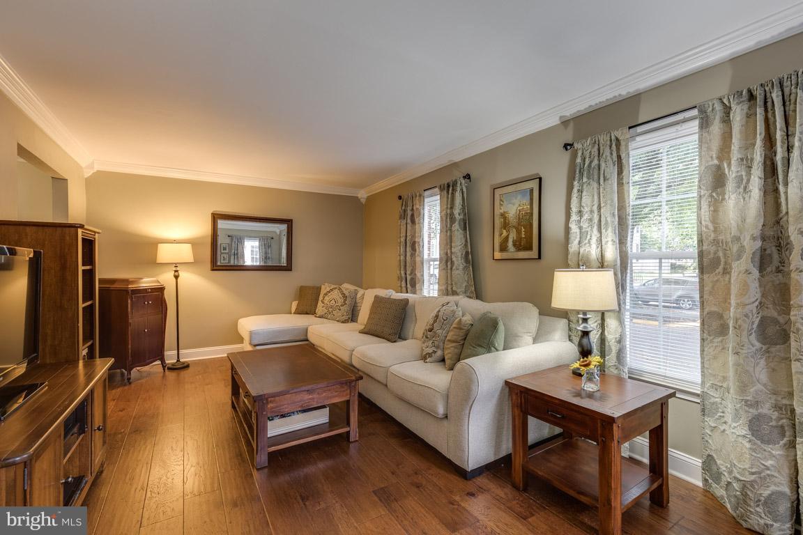 11841 Dunlop Court Reston, VA 20191 - Photo 6 of 30 a living room with furniture and a flat screen tv