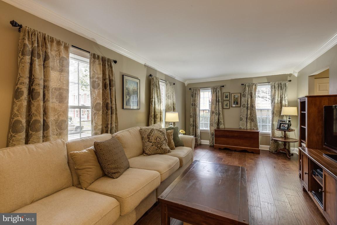 11841 Dunlop Court Reston, VA 20191 - Photo 7 of 30 a living room with furniture and a flat screen tv