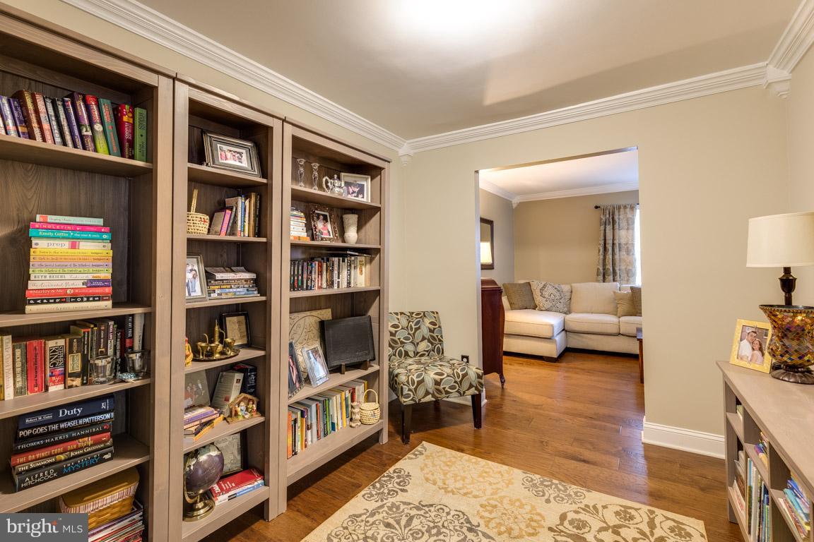 11841 Dunlop Court Reston, VA 20191 - Photo 8 of 30 a living room with furniture and a book shelf