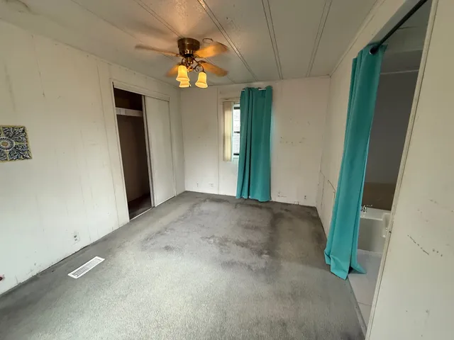 a view of a hallway with a chandelier