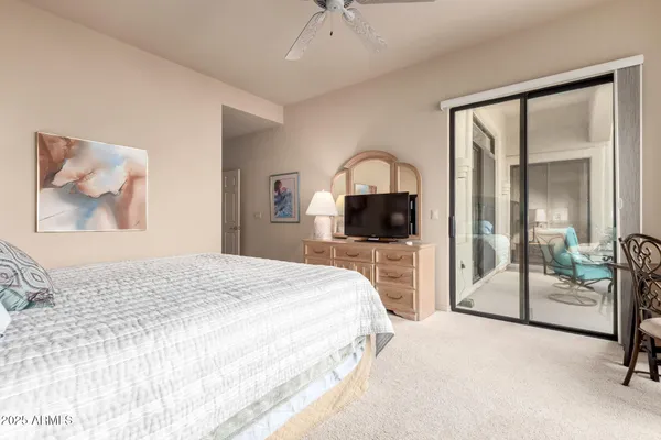 a bedroom with a bed and a mirror