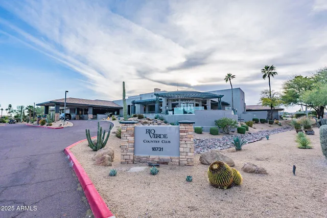 an aerial view of a house with yard and sitting area