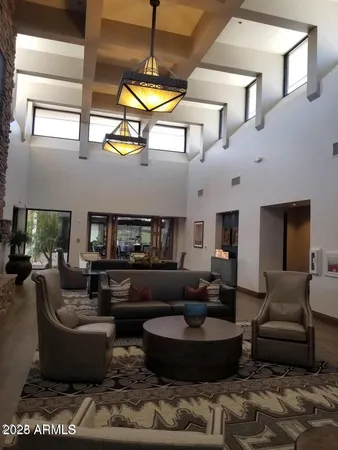 a living room with furniture and a large window