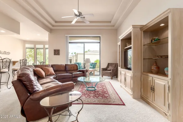 a living room with furniture and a window