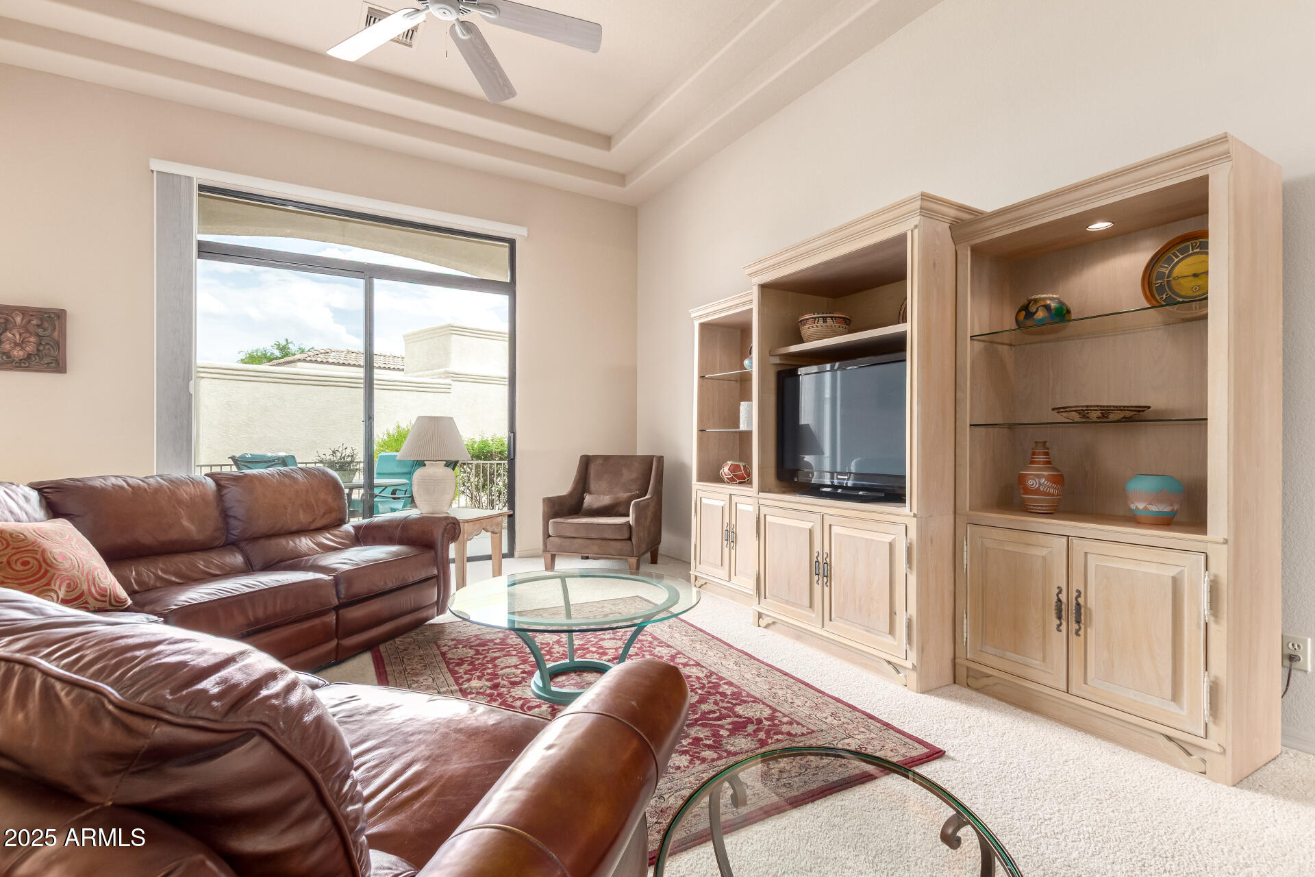 25621 North Sago Drive Rio Verde, AZ 85263 - Photo 5 of 45 a living room with furniture and a flat screen tv