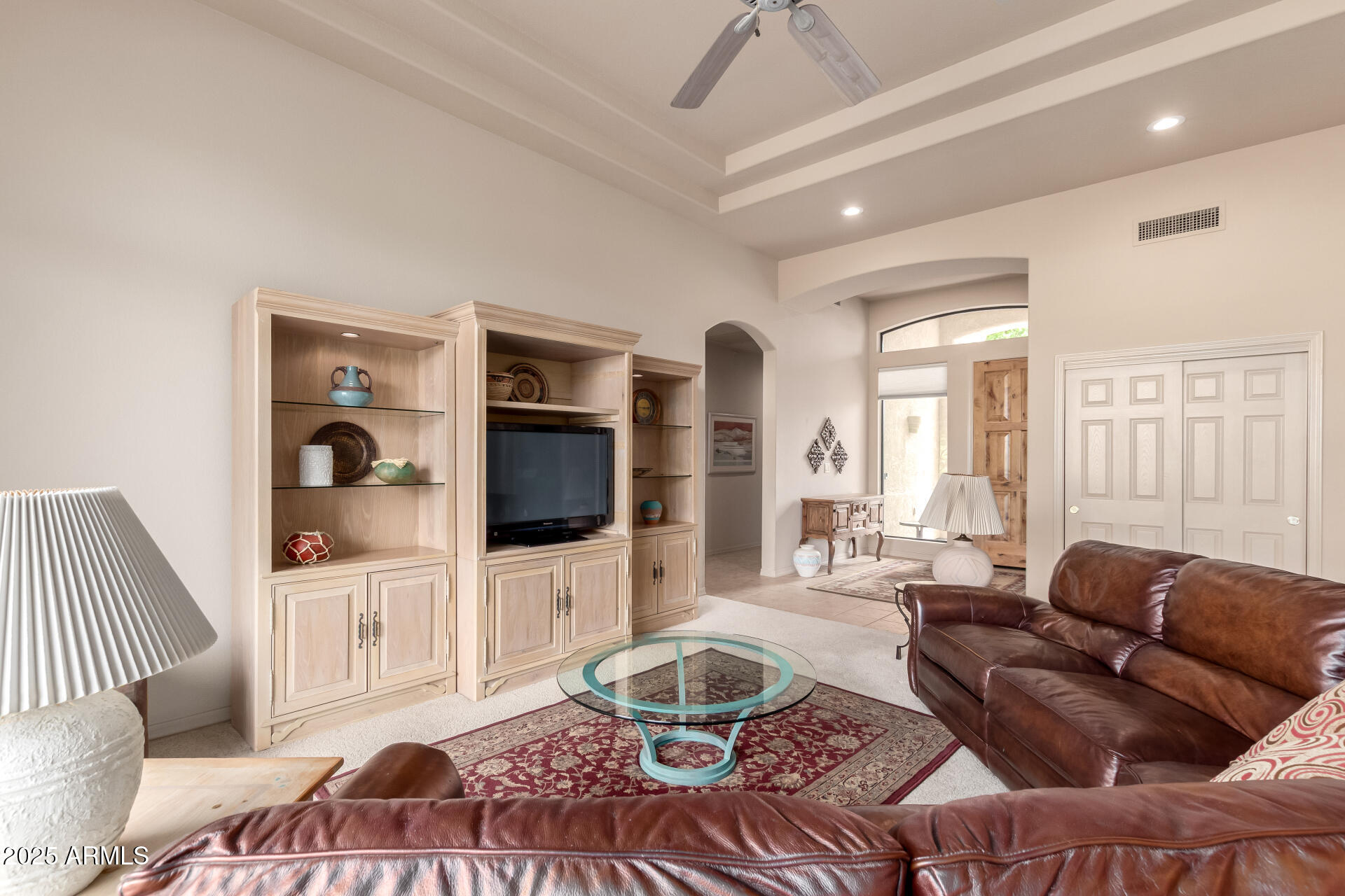 25621 North Sago Drive Rio Verde, AZ 85263 - Photo 6 of 45 a living room with furniture and a flat screen tv