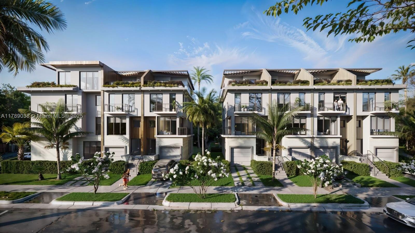 1425 Bay Road Miami Beach, FL 33139 - Photo 1 of 15 a front view of multiple houses with yard