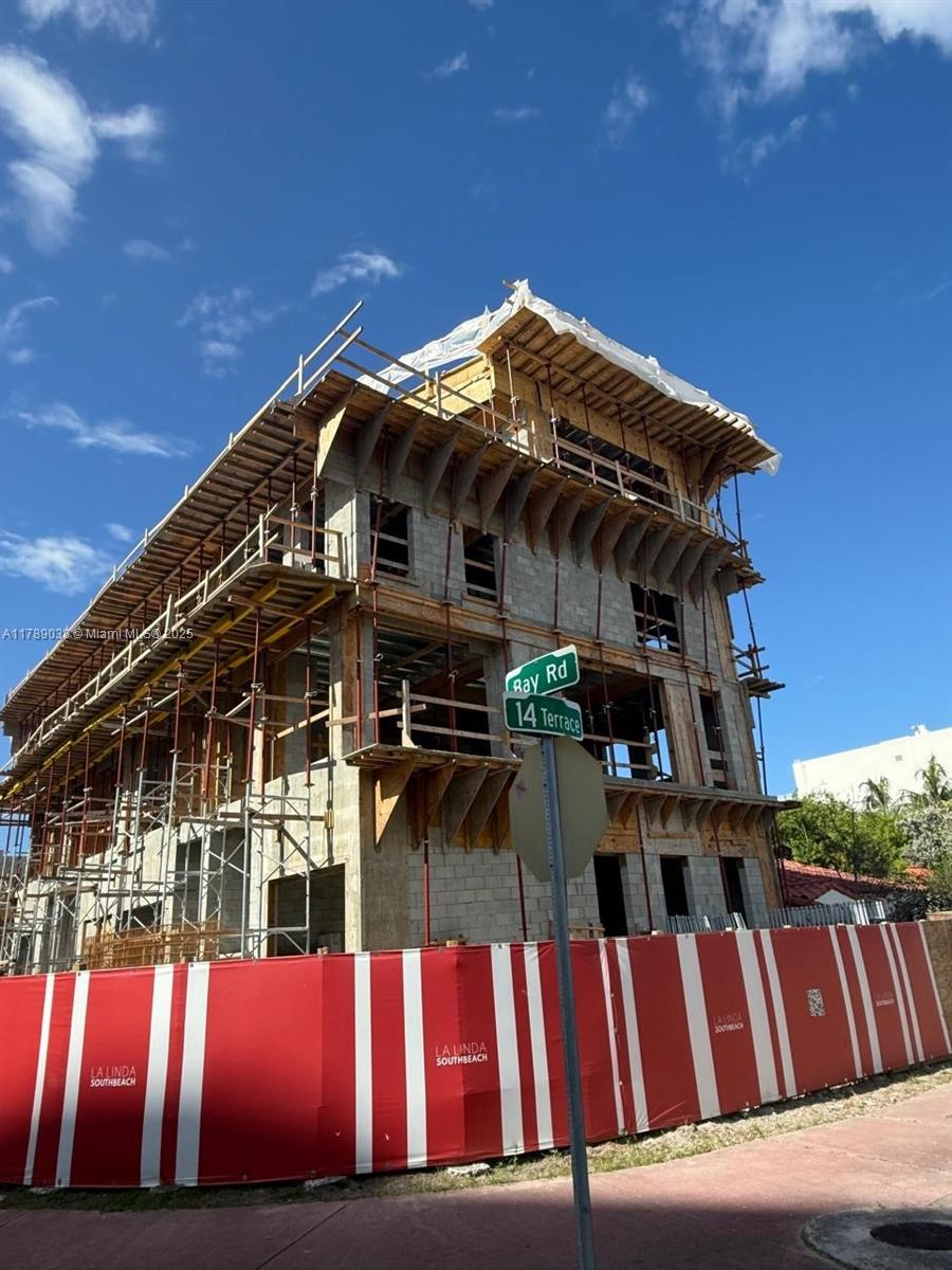 1425 Bay Road Miami Beach, FL 33139 - Photo 13 of 15 a view of a house with wooden fence