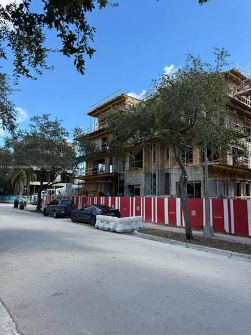 a view of street with parked cars