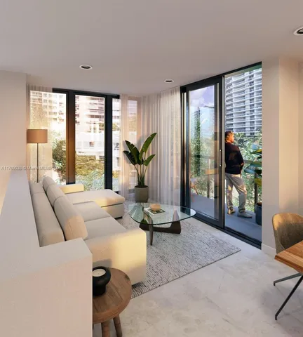 a living room with furniture and large windows