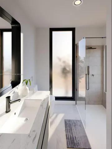 a bathroom with a shower and a sink