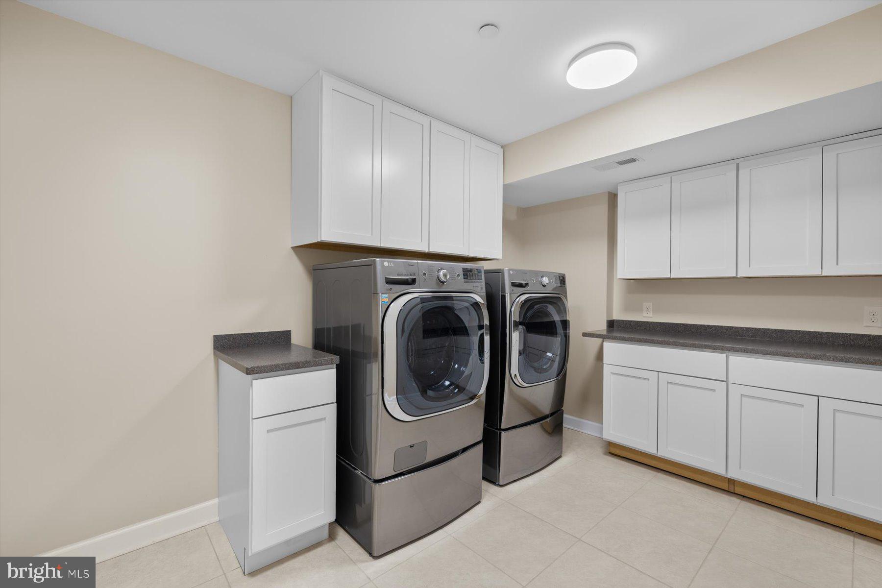 35 Inlet View Court Bethany Beach, DE 19930 - Photo 67 of 74 a utility room with sink dryer and washer