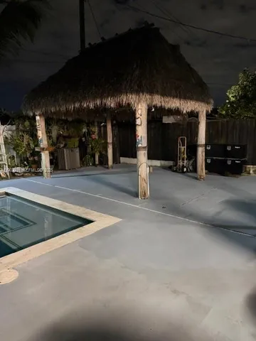 a view of a chairs and tables in patio