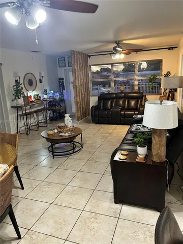 a living room with lots of furniture and a table