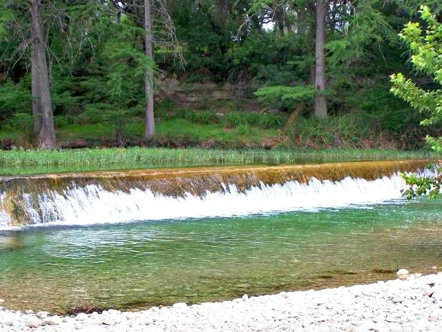 a view of a lake with a big yard