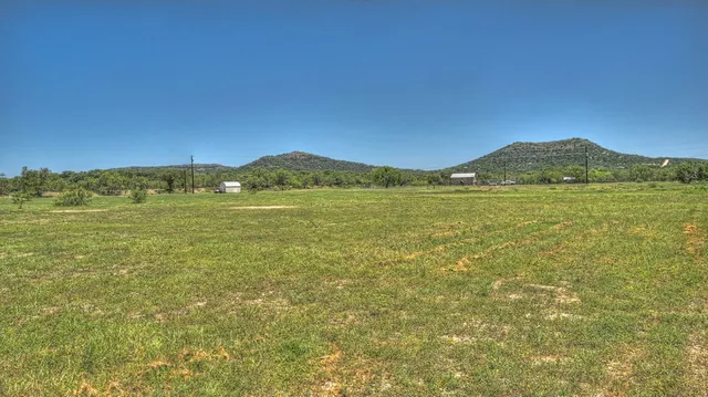 a view of an ocean and a mountain