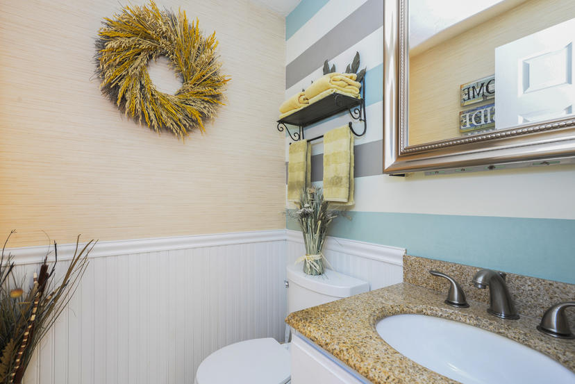 16 Walton Road Harwich, MA 02645 - Photo 11 of 20 a bathroom with a granite countertop sink and a toilet
