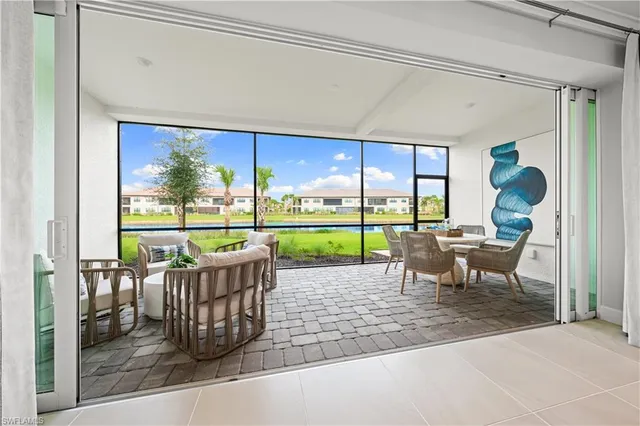 a view of a house with backyard and porch