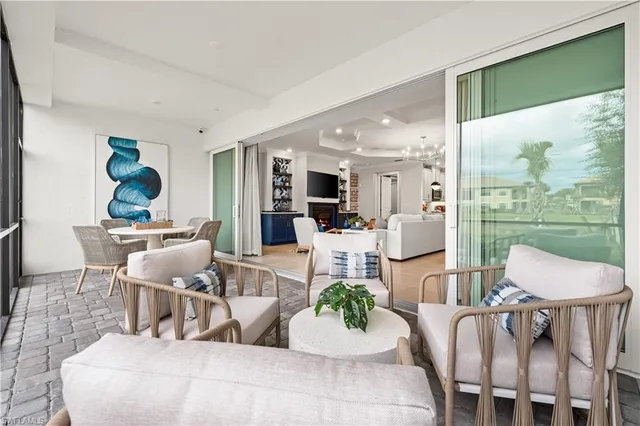 a view of a swimming pool with a table and chairs