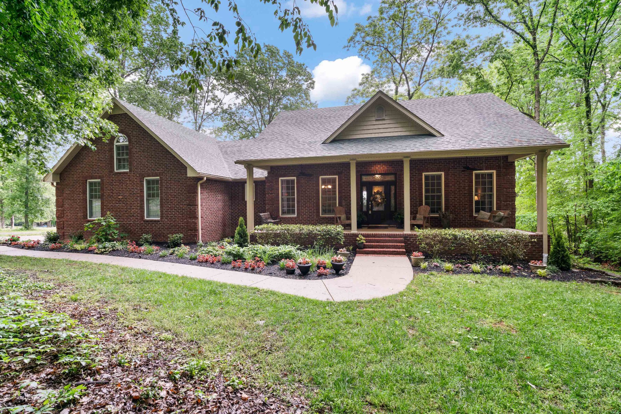 1976 Cooks Road Mount Juliet, TN 37122 - Photo 1 of 70 a front view of a house with a yard and porch