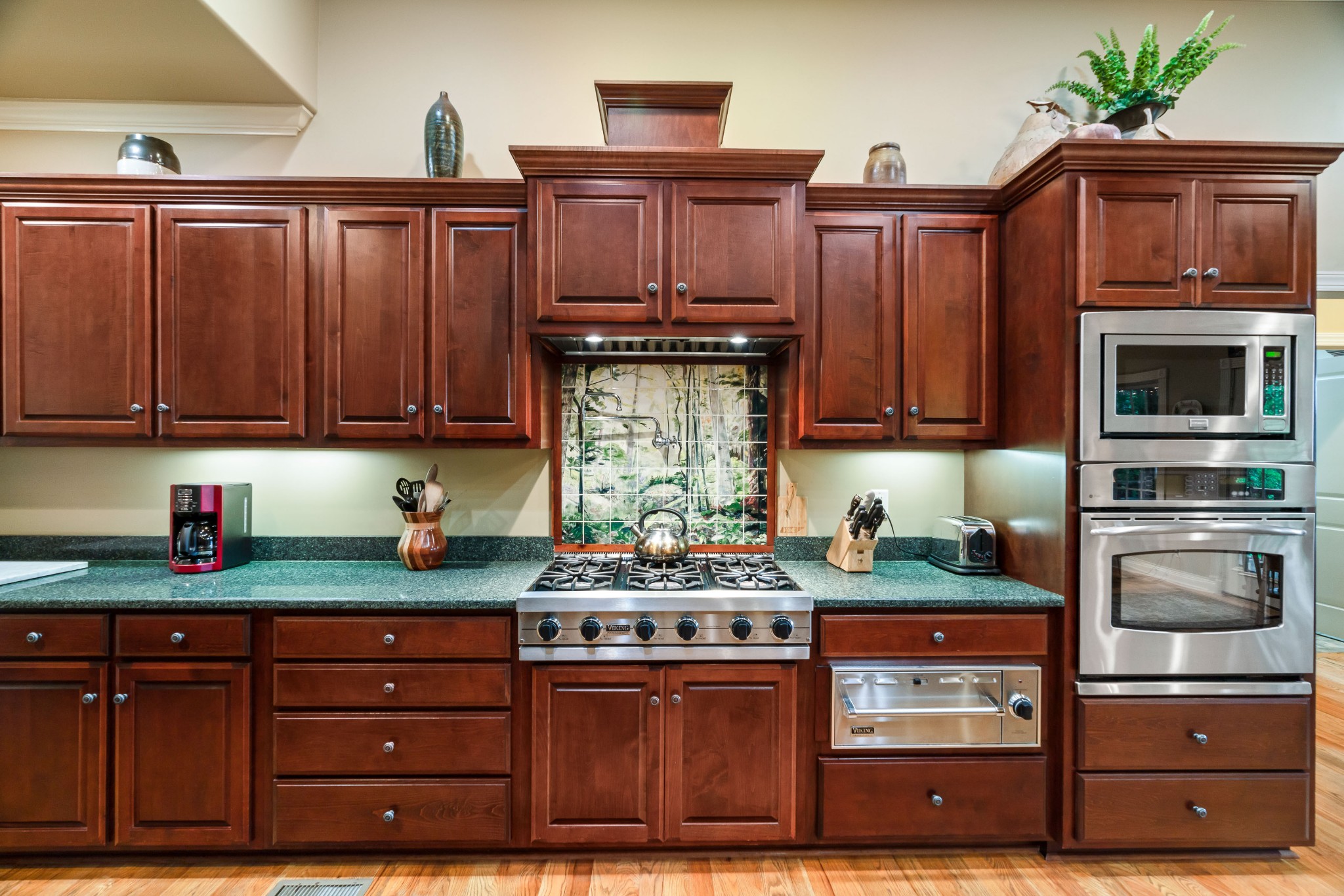 1976 Cooks Road Mount Juliet, TN 37122 - Photo 23 of 70 a kitchen with stainless steel appliances granite countertop wooden cabinets and a stove top oven