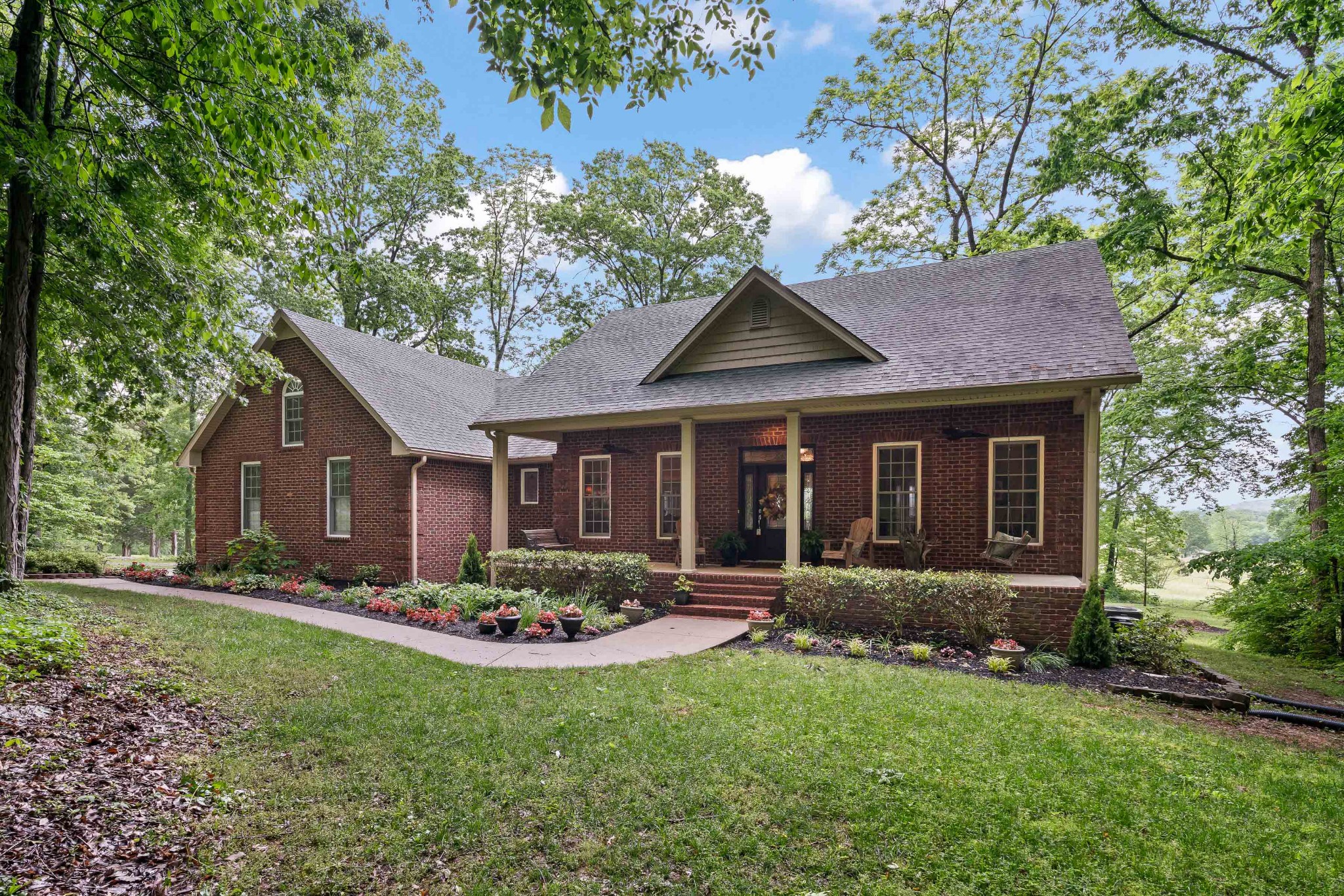 1976 Cooks Road Mount Juliet, TN 37122 - Photo 3 of 70 a front view of a house with garden