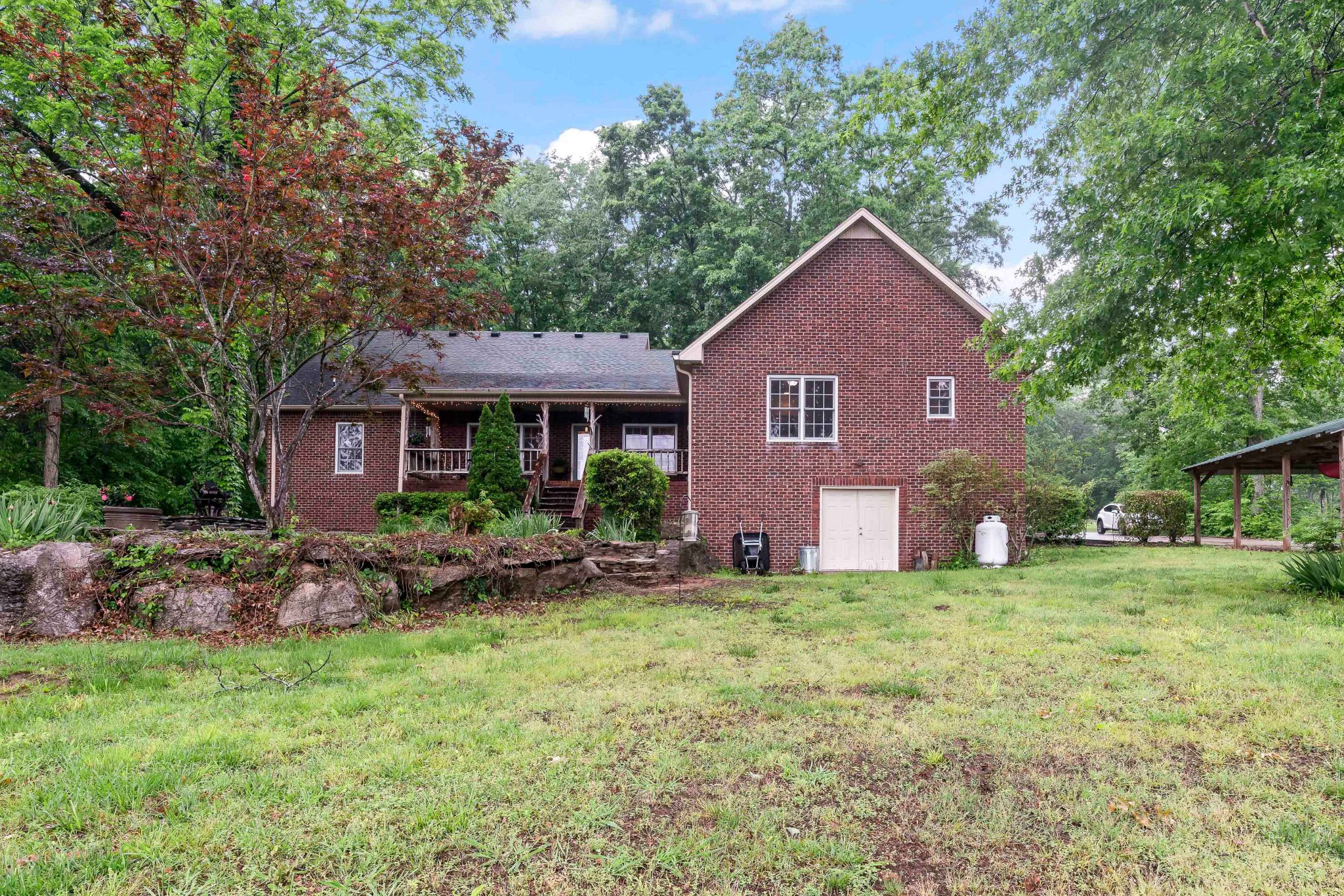 1976 Cooks Road Mount Juliet, TN 37122 - Photo 62 of 70 a front view of a house with garden
