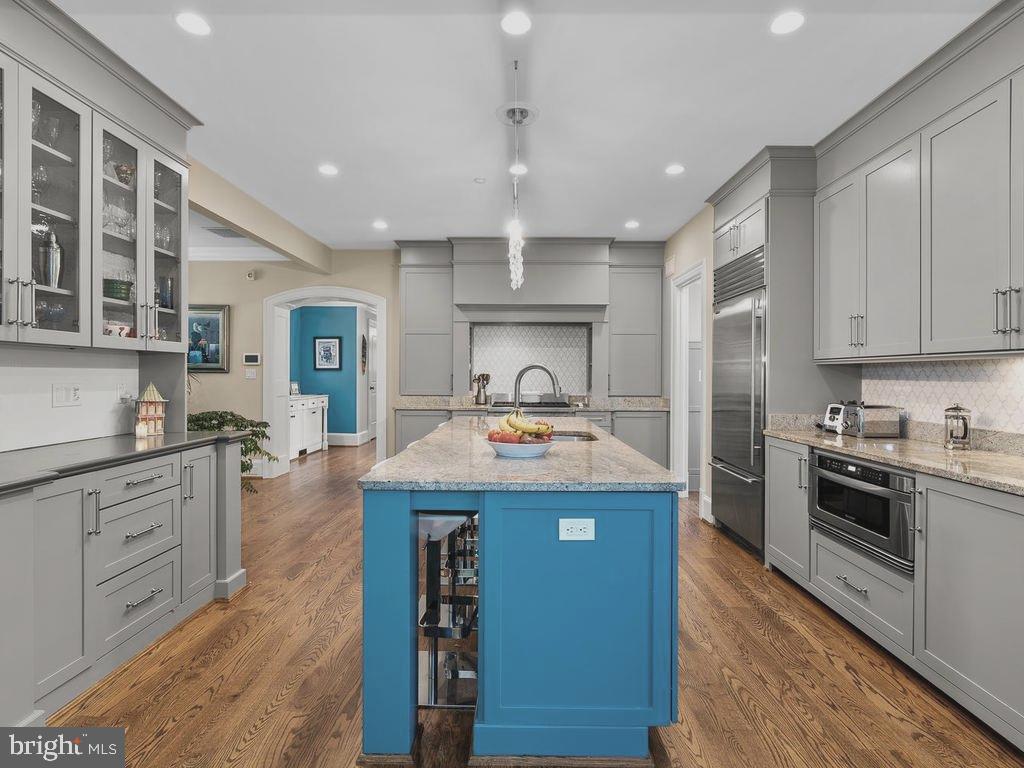 4400 Elm Street Chevy Chase, MD 20815 - Photo 12 of 61 a kitchen with granite countertop a sink and stainless steel appliances
