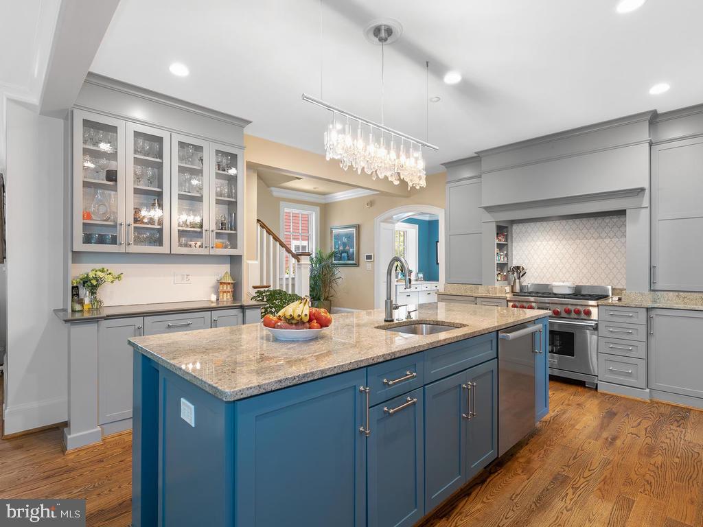 4400 Elm Street Chevy Chase, MD 20815 - Photo 17 of 61 a kitchen with a sink stove and refrigerator