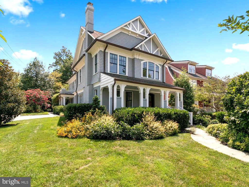 4400 Elm Street Chevy Chase, MD 20815 - Photo 2 of 61 a front view of a house with a yard