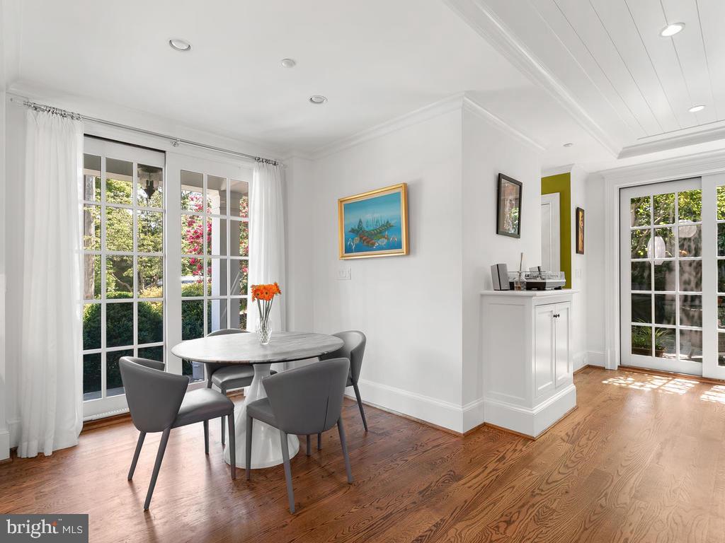 4400 Elm Street Chevy Chase, MD 20815 - Photo 23 of 61 a view of a dining room with furniture window and wooden floor