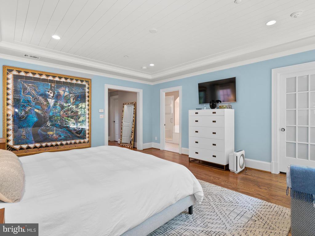 4400 Elm Street Chevy Chase, MD 20815 - Photo 26 of 61 a bedroom with furniture and flat screen tv