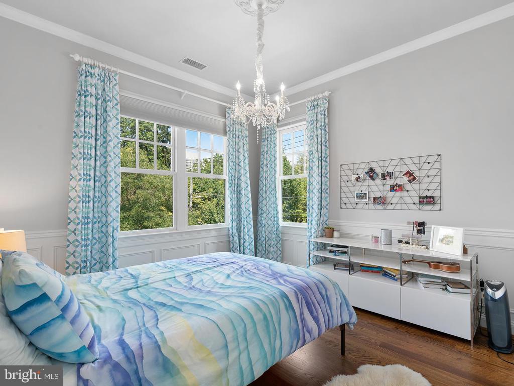 4400 Elm Street Chevy Chase, MD 20815 - Photo 32 of 61 a bed sitting in a bedroom next to a window