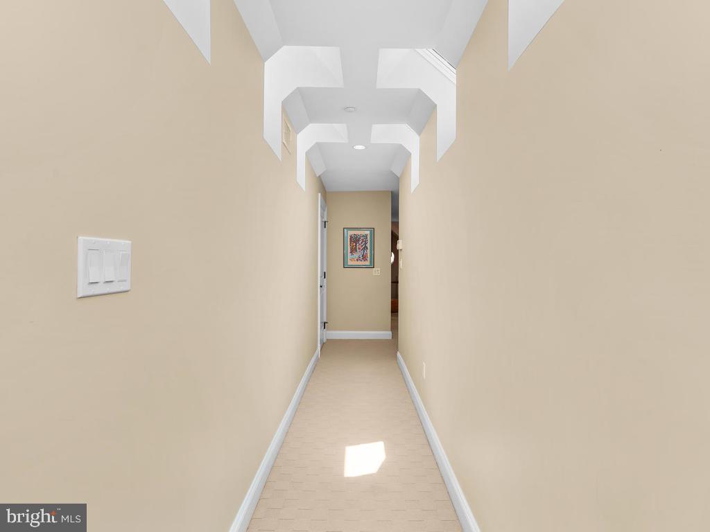 4400 Elm Street Chevy Chase, MD 20815 - Photo 36 of 61 a view of a hallway with wooden floor