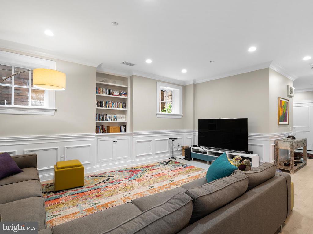 4400 Elm Street Chevy Chase, MD 20815 - Photo 39 of 61 a living room with furniture and a flat screen tv